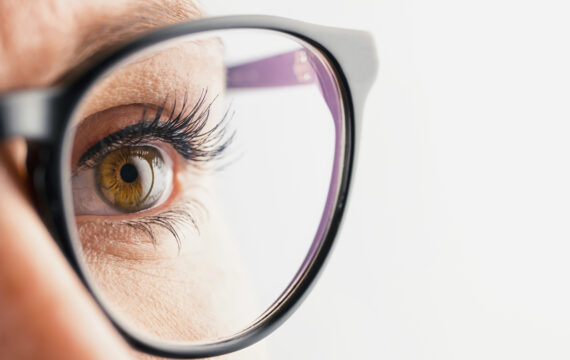 A close-up of eye from a Businesswoman with black glasses. ideal for websites and magazines layouts.